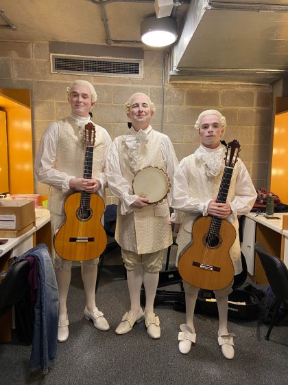 All in regency stage costume, George (left) pictured with the percussionist and guitarist - with their instruments -  who were also on-stage performers for Don Pasquale.